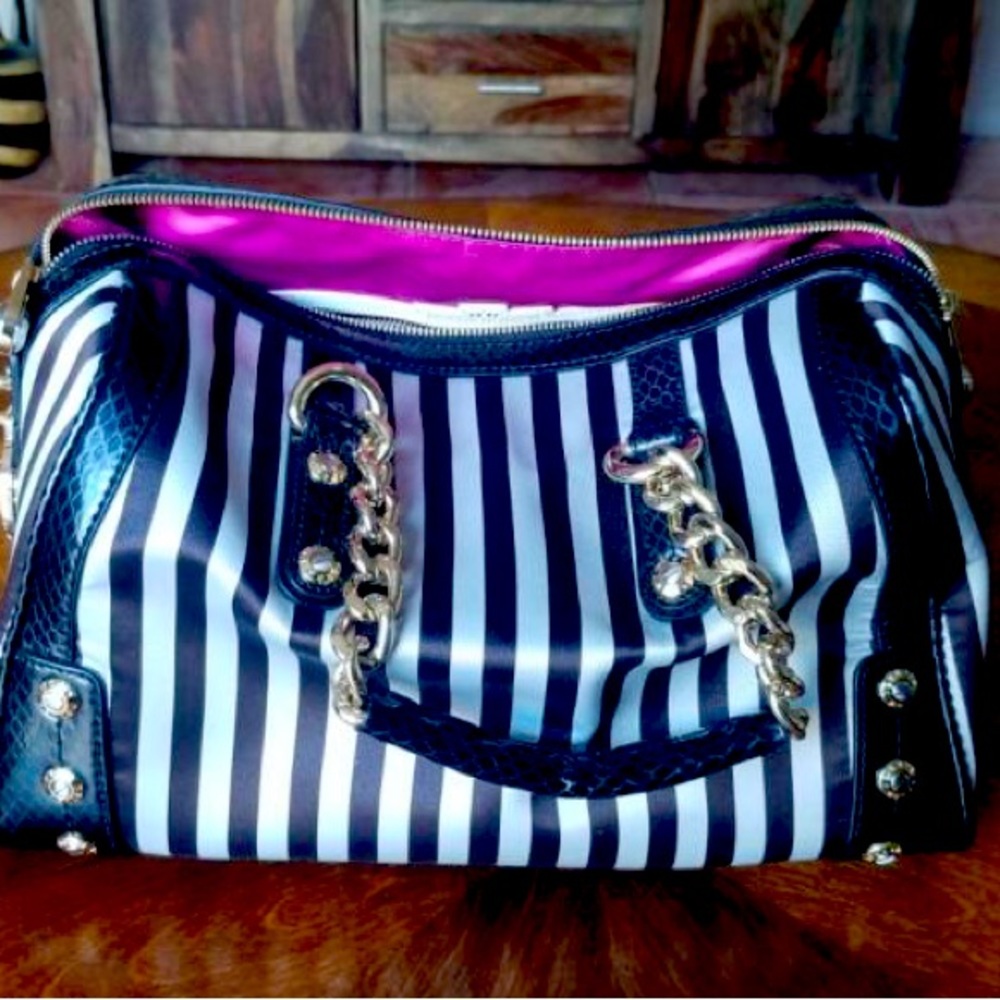 Hebri Bendel bowler bag. Classic black and white stripes fuscia pink lining
